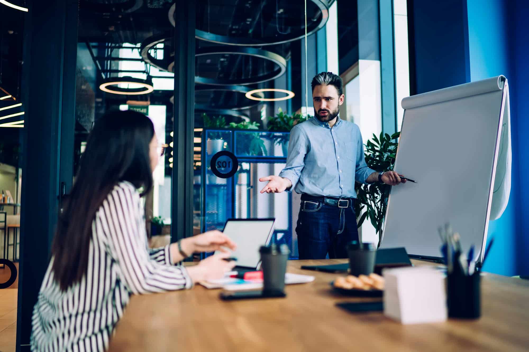 Colleagues making business decisions in meeting room